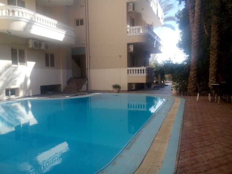 2-room apartment in a compound with a swimming pool (El Kawther)